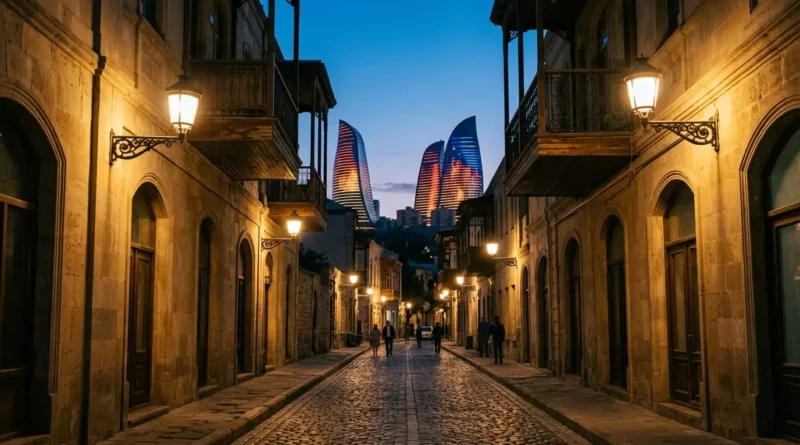 Baku Old City lanes with the Flame Towers lit on the hill after sunset