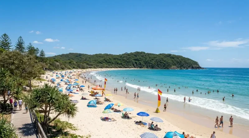 Sandy beach at Noosa on the Sunshine Coast with clear water and surf