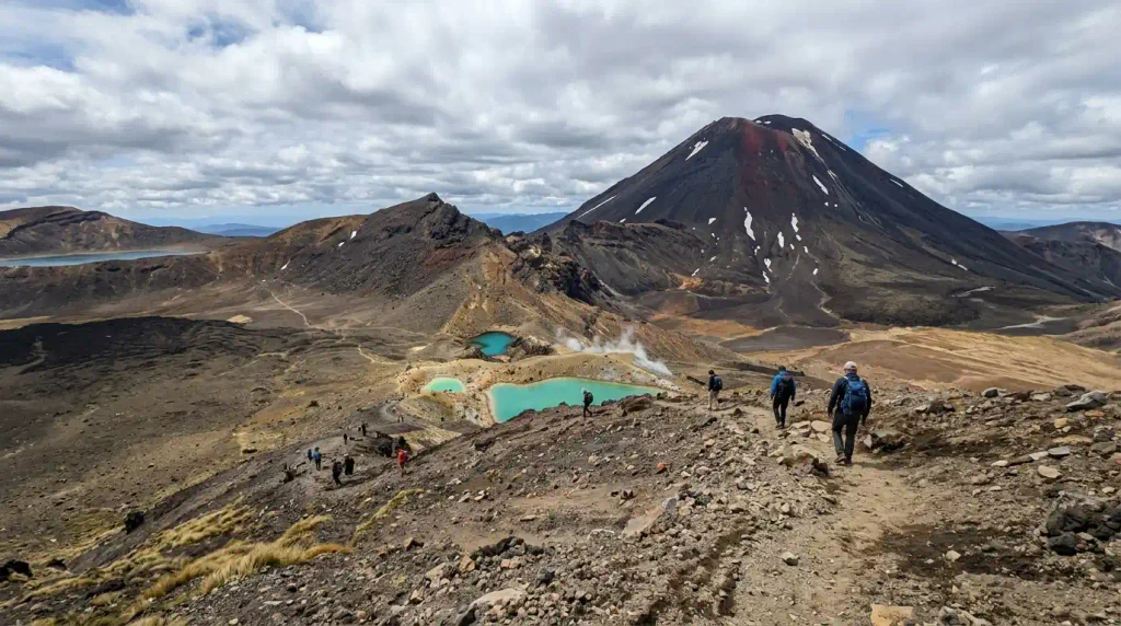 Hikers on Tongariro Alpine Crossing near Emerald Lakes